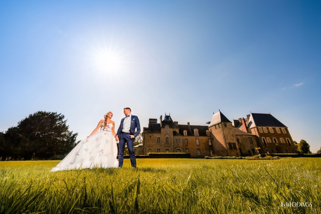 bride and groom laughing hard while being photographed in a storytelling style by Chuck on their destination wedding in France