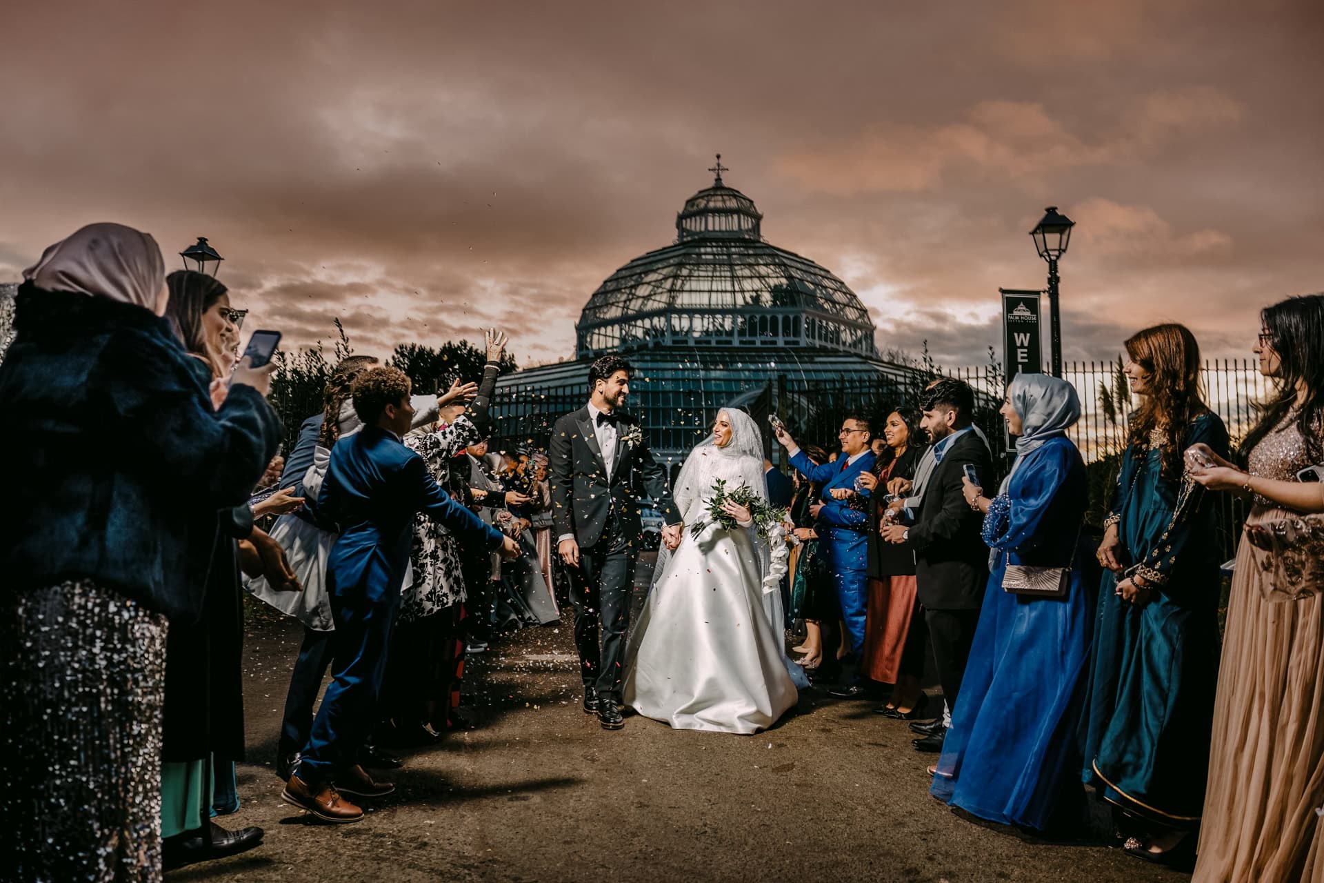 Asian Middle East Bride and groom exit glass conservatory wedding near Marbella