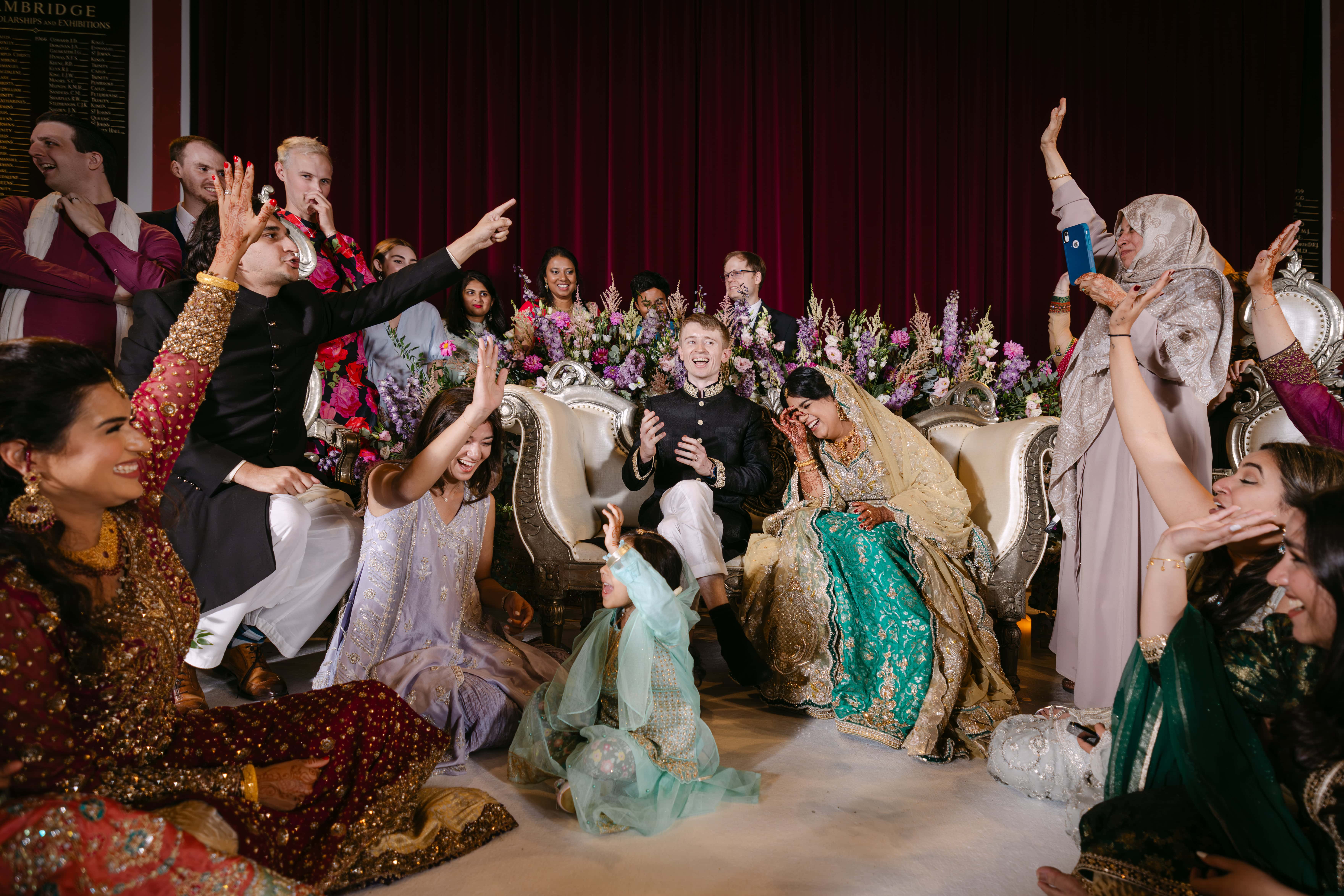 Joyful wedding celebration with bride and groom seated